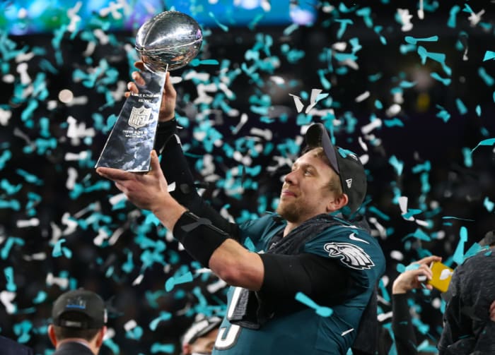 Philadelphia Eagles quarterback Nick Foles hoists the Vince Lombardi Trophy after a victory against the New England Patriots in Super Bowl LII at U.S. Bank Stadium in 2018.